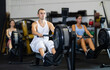 © JackF - Strong sportsman training at cable row machine in modern crossfit gym