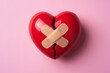 © Vision Orbit - Broken heart with band aid concept for healing emotional pain and relationship repair
