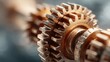 © SSP - A close-up image of interlocking gears, showcasing their intricate design and metallic texture, highlighting the mechanics of machinery.