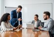 © SHAPLA - Diverse business team collaborating in a modern meeting room