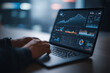 © Enrique - Data analytics and graphs. Analysis of statistical business marketing data. Data scientist using laptop computer to analyze data