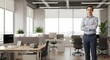 © Artem - Professional young man poses confidently in modern office space during daylight hours