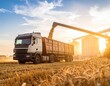 © Alex - Agricultural truck transporting harvested grain from field to storage facility during sunset, showcasing farming equipment and golden wheat landscape with dramatic sky