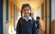 © lan - Smiling student in school uniform with backpack, warm autumn light in hallway, back-to-school season concept. High quality