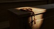 © Lucas - Wooden prayer beads rest on a pew, catching the sunlight filtering through the church window.