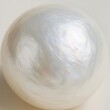 © Vladimir Steblev - Close-up macro view of pearl surface texture with iridescent shine