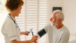 © Monkey Business - Female Nurse Wearing Uniform Taking Blood Pressure Of Senior Man In Private Hospital Room