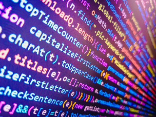 Real Java Script code developing screen. Blue color. Blue theme. Website HTML Code on the Laptop Display Closeup Photo. Coding, programming, hacking concept. Coding cyberspace concept