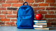 © Mariya Sorvacheva - September 1 - Knowledge Day: school backpack and a stack of books