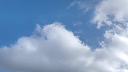 Wall Mural - filming of a heavenly landscape with small clouds