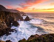 © Maung - Dramatic sunset over rugged coastline