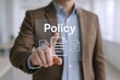 © Generative AI - Man Taps 'Policy' on Transparent Touchscreen Display, Signifying Agreement with Terms and Conditions Document
