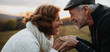 © Halfpoint - Senior couple holding hands, standing face to face.