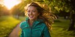 © Alkal - The joyful woman running freely in a sunlit park.