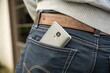 © Роман Заворотный - Person Standing With Smartphone in Back Pocket During Outdoor Activity