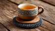 © Shamsul - Wooden Cup of Tea on Wooden Coaster with Knitted Fabric