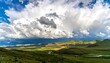 © Nadia - Mountain valley landscape with dramatic clouds