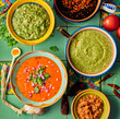 © Darren Muir/Stocksy - Mexican style salsa's and sauces on green tile background