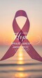 © AlfaSmart - Hope and support: pink ribbon symbolizing breast cancer awareness at serene sunset, ideal for awareness campaigns and inspirational content