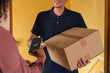 © Milles Team/Stocksy - Anonymous delivery person accepting payment for goods from client