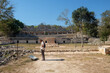 © Studio KME/Stocksy - Tourist Exploring Uxmal's Open Grounds
