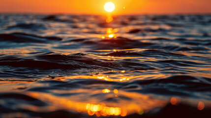 Wall Mural - Sunset over ocean creates serene atmosphere with golden sunlight reflecting on water surface, evoking sense of tranquility and beauty
