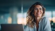 © NovaVision - A woman wearing glasses smiles, possibly planning her next successful steps in a modern office