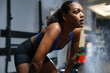 © Rob and Julia Campbell/Stocksy - Determined Athlete Taking a Rest During an Intensive Workout Session