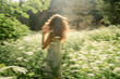 © Lea Jones/Stocksy - young woman dancing  in a field of wild flowers