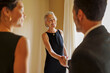 © BONNINSTUDIO/Stocksy - Woman shaking hands with financial advisor at office meeting