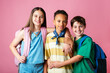 © Peninsula/Stocksy - Cool kids Posing Together on Pink Background