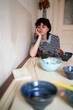 © Studio Sincère/Stocksy - Feeling Contemplative While Surrounded by Empty Bowls at a Table