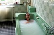 © Studio Sincère/Stocksy - Woman Enjoying a Relaxing Bath in a Vintage Bathroom Setting