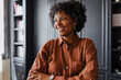 © BONNINSTUDIO/Stocksy - Confident lawyer smiling in modern office