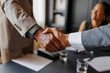© BONNINSTUDIO/Stocksy - Business people shaking hands after closing a deal in lawyers office