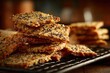 © isz - Crispy Savory Crackers with Seeds on Dark Baking Tray Close Up