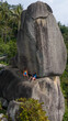 © Studio KME/Stocksy - Tourists at Famous Rock Formation