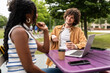 © Alvaro Lavin/Stocksy - University students relaxing at campus cafe