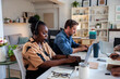 © Jovo Jovanovic/Stocksy - People working on laptops in a bright, modern office
