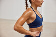 © Javier Díez/Stocksy - Athlete training indoors with focused posture and determination