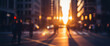 © birulaut - Blurred city street scene with pedestrians and buildings at sunset or sunrise, capturing a warm atmospheric urban moment with soft golden tones.