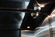 © Jovo Jovanovic/Stocksy - Security camera and light fixture in a metal elevator.