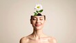 © upin - Serene woman with a daisy sprouting from her open head against a neutral background