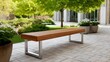 © Olga - Modern wooden bench in tranquil garden setting with lush greenery and paved pathway