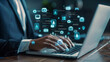 © Kashif - Document management system DMS. Folder structure and classification system. File and folder icons. Businessman using laptop computer for controlling document