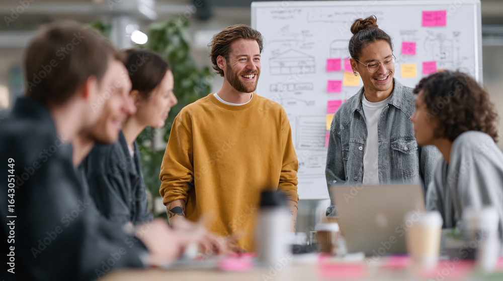 Creative professionals collaborate in a modern office. Diverse team ...