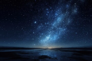 Wall Mural - vast starry sky illuminated by countless stars over a calm body of water at dusk in a remote locatio