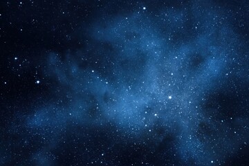 Wall Mural - starry night sky filled with countless white specks against a deep blue background showcasing the be