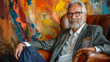 © Nibir - Stylish older man with gray hair and beard wearing glasses and a suit jacket sitting in a leather chair with colorful abstract art behind him