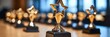 © Ilja - Elegant corporate awards ceremony celebrating outstanding achievements with shining trophies.